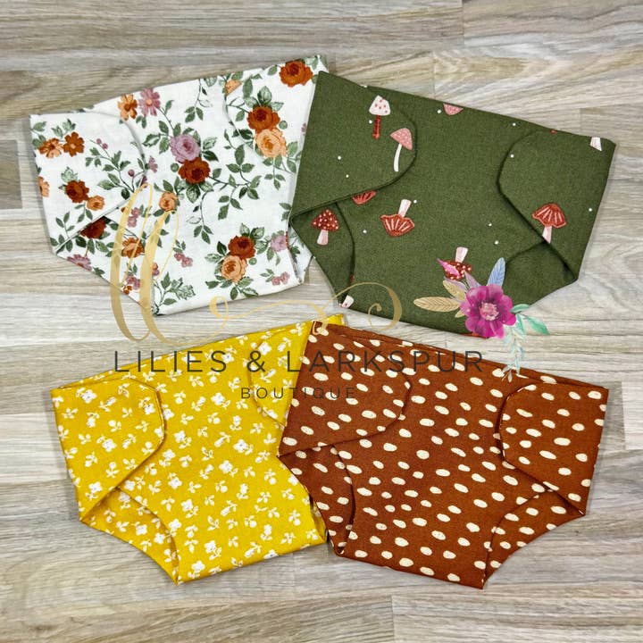 Handmade Doll Diapers with hook and loop closures for wholesale by Lilies & Lark Boutique