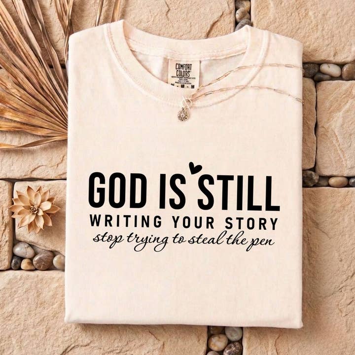 God Is Still Writing Your Story Comfort Colors Faith Tee for wholesale by PressPilotCo