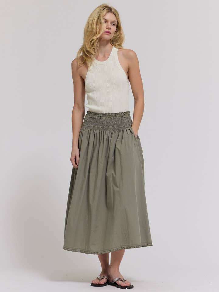 50908 - EYELET TRIM DETAILED SMOCKING WAIST SKIRT for wholesale by Grade & Gather