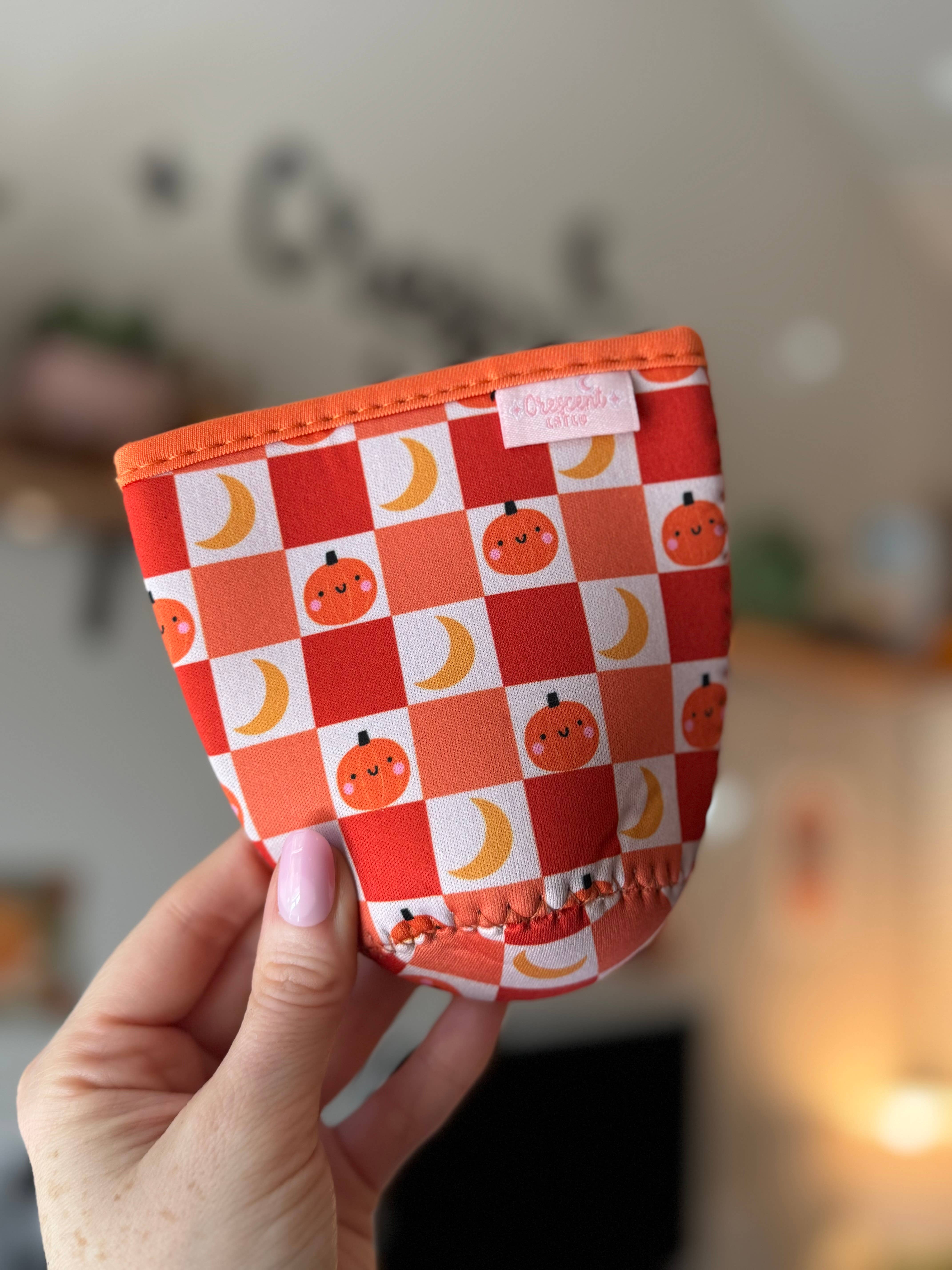 CrescentCatCo - Wholesale Drink Huggers & Koozies - Pumpkin Checkered Spooky Iced Coffee Drink Sleeve (Copy)1