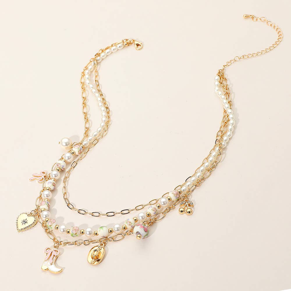 Sensibling Corp. - Wholesale Pendant/Charm Necklace - Western Cowboy Boot Hat Bow Cherry Heart Charm Station Pearl Floral Ceramic Ball Beaded Layered Necklace1