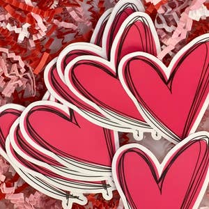 Purchase Wholesale heart stickers. Free Returns & Net 60 Terms on Faire