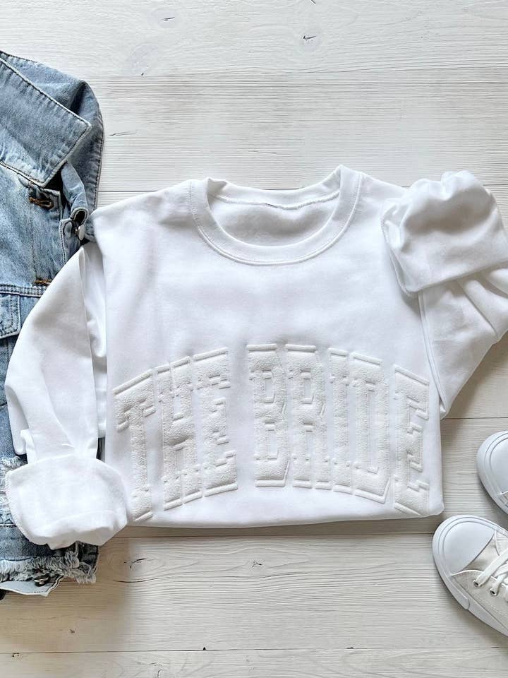 White Embossed "The Bride" Sweatshirt for wholesale on Faire
