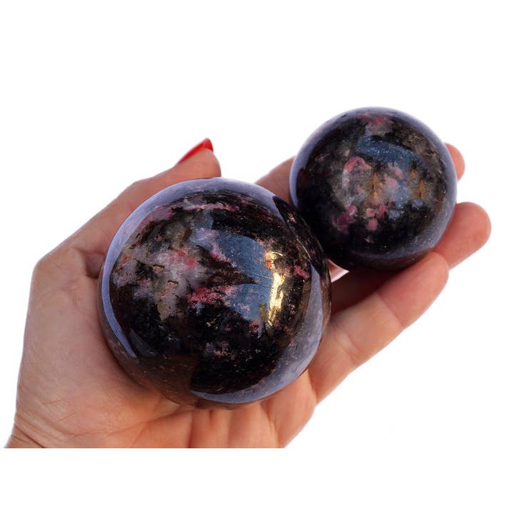 Rhodonite Sphere Crystal (45mm - 65mm) for wholesale by Kaia & Crystals