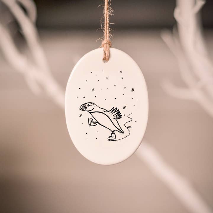Skating Puffin Ceramic Tree Decoration for wholesale by frog and gnome
