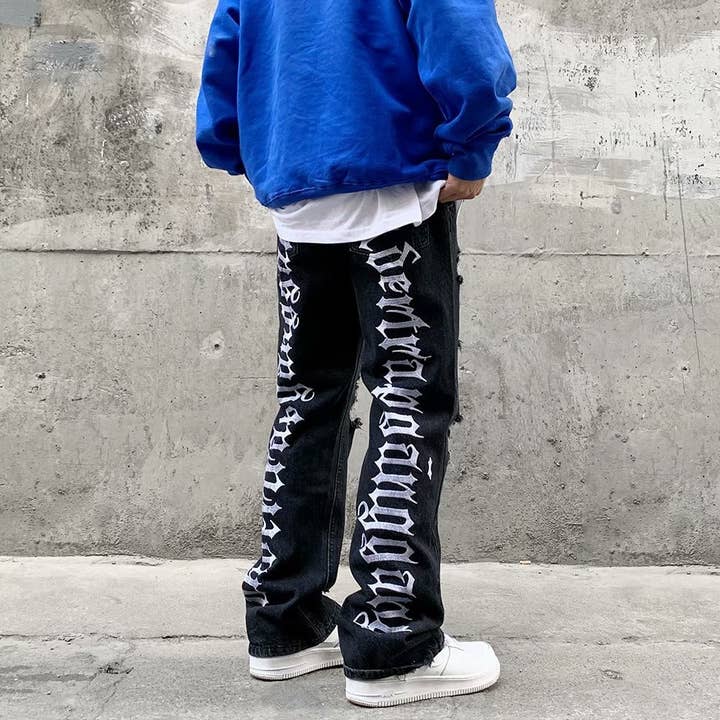Black Men's hip-hop ripped jeans with letters embroidered for wholesale on Faire