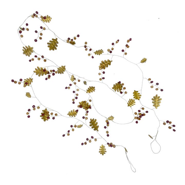 Oak leaf garland in brass and wooden beads for wholesale by Maison Lilo
