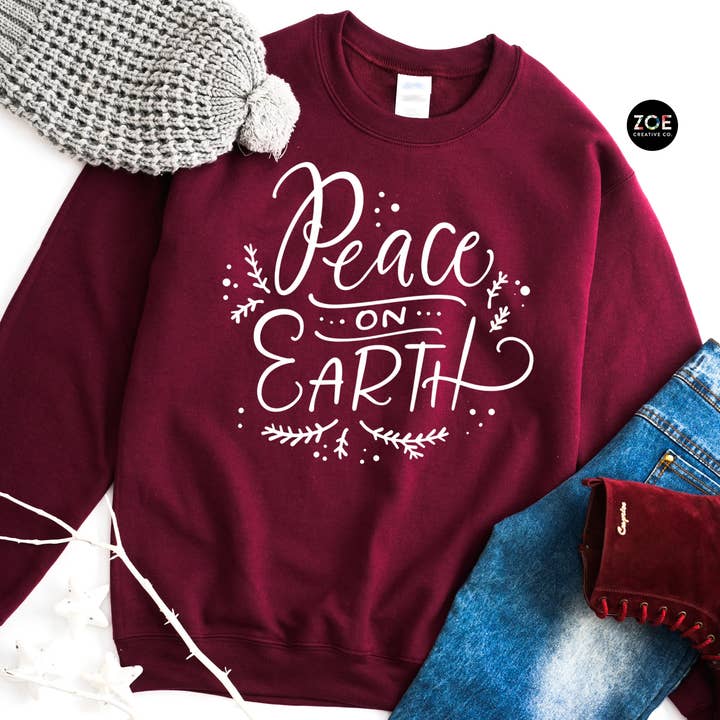Cozy Christmas Sweatshirt Peace On Earth Design Holiday Tees for wholesale by Zoe Creative Co
