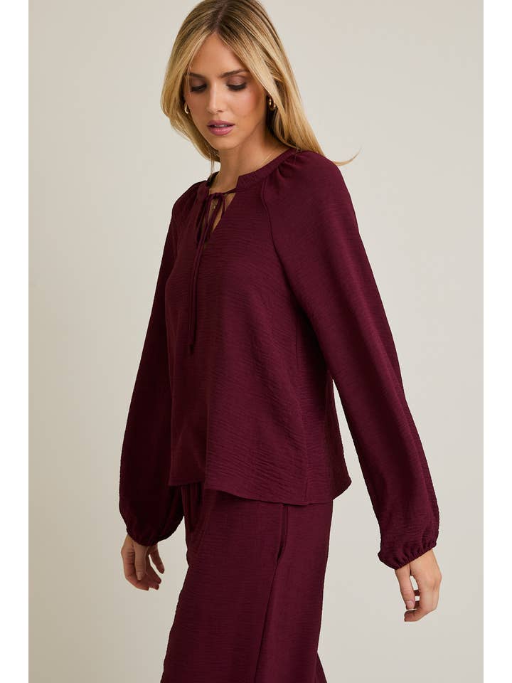 WINE FRONT TIE LONG SLEEVE TOP for wholesale on Faire1