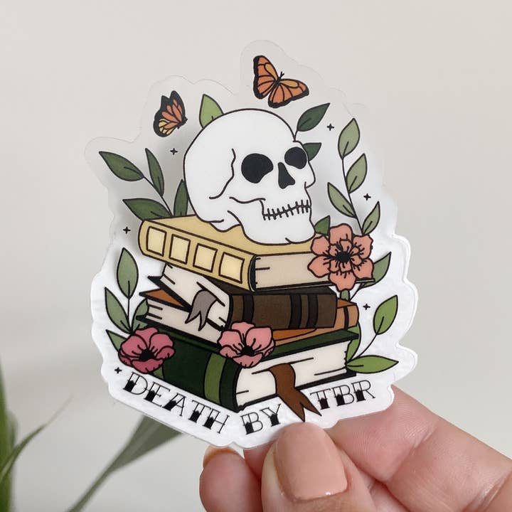 Autocollant Death By TBR Skull Book Stack transparent pour la vente par Clay Collection Co.