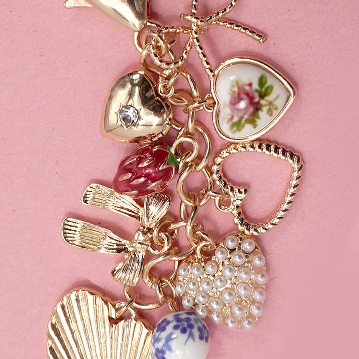 Gold PORCELAIN BOWS HEARTS PEARL STRAWBERRY BAG CHARM | 80K008 for wholesale on Faire
