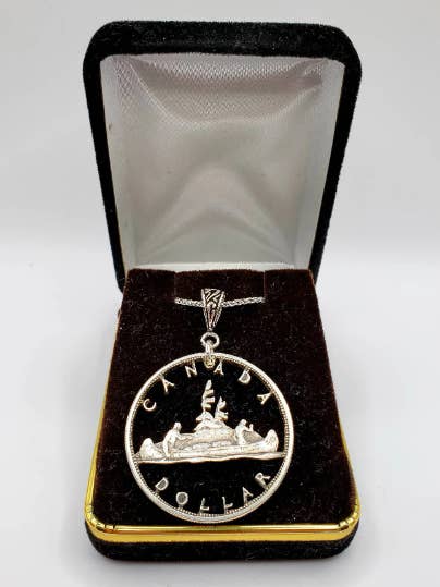 Hand Carved Canadian Silver Dollar for wholesale by Lost Things Artisan Jewelry