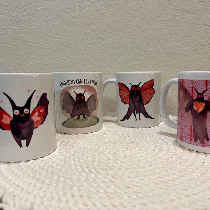 Set of 4 Different Mothman 110z Ceramic Mugs in Gift Boxes for wholesale by Cryptic Paper Co.