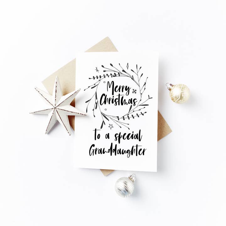 Merry Christmas Granddaughter Card - Black Wreath Design for wholesale by Flash On A String Designs