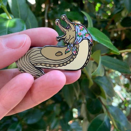 Babushka slug enamel pin for wholesale by Madame Bagnabit