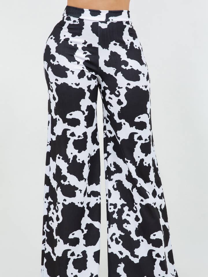 BLACK WHITE B11401 TECHNO CREPE COW PRINT PANTS WITH BACK METAL ZIPPER for wholesale on Faire0
