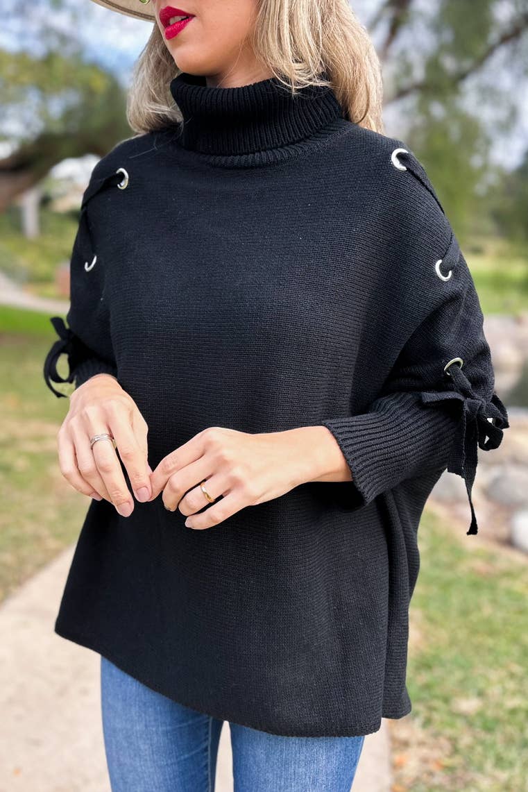 Noir Poncho tricoté noir avec col roulé et manches lacées en vente sur Faire2