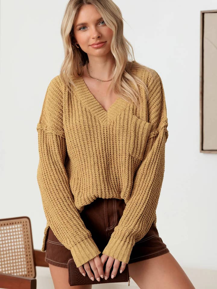 Jersey con cuello en V y manga larga con bolsillo frontal único para venta al por mayor de Tasha Apparel Wholesale