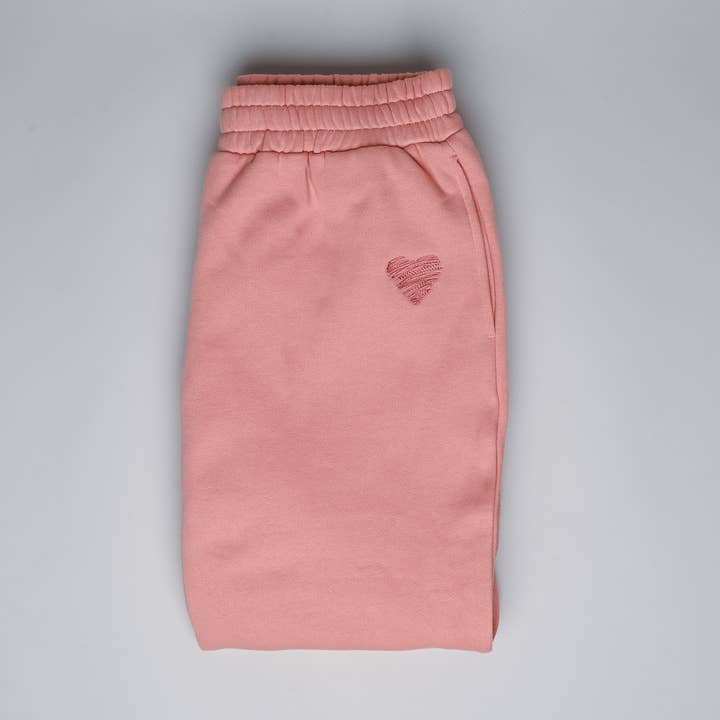 Pantaloni sweatpant rosa nude con ricamo 'be wild for a while' per la vendita all'ingrosso da parte di ANSHIN