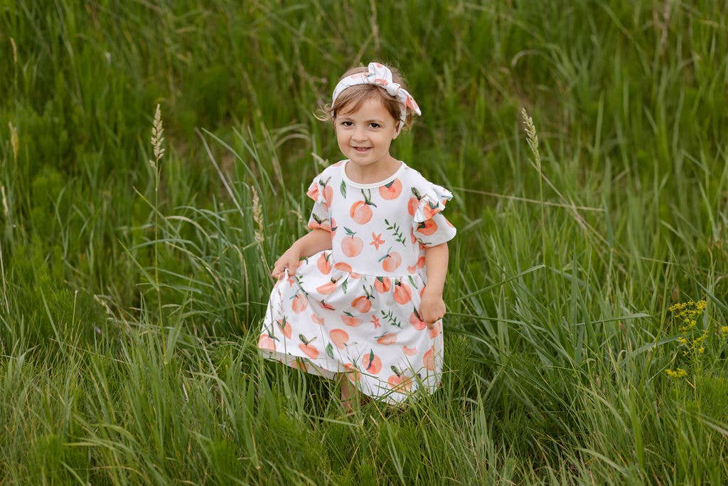 TeoBee - Wholesale Jurk - Kinderen - Meisjesjurk met korte mouwen in perzikoranje, draaiend, 3m - 8j3