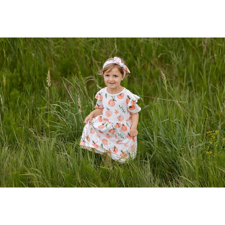 TeoBee - Wholesale Jurk - Kinderen - Meisjesjurk met korte mouwen in perzikoranje, draaiend, 3m - 8j3