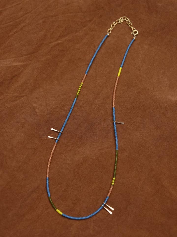 Dainty beaded necklace- in blue with 14k gold accents for wholesale by Freestone