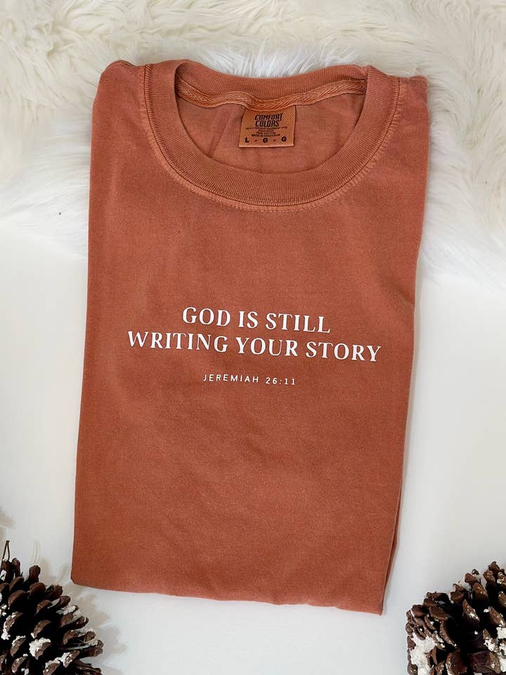 God Is Still Writing Your Story Christian T-shirt for wholesale by Only Grace Company
