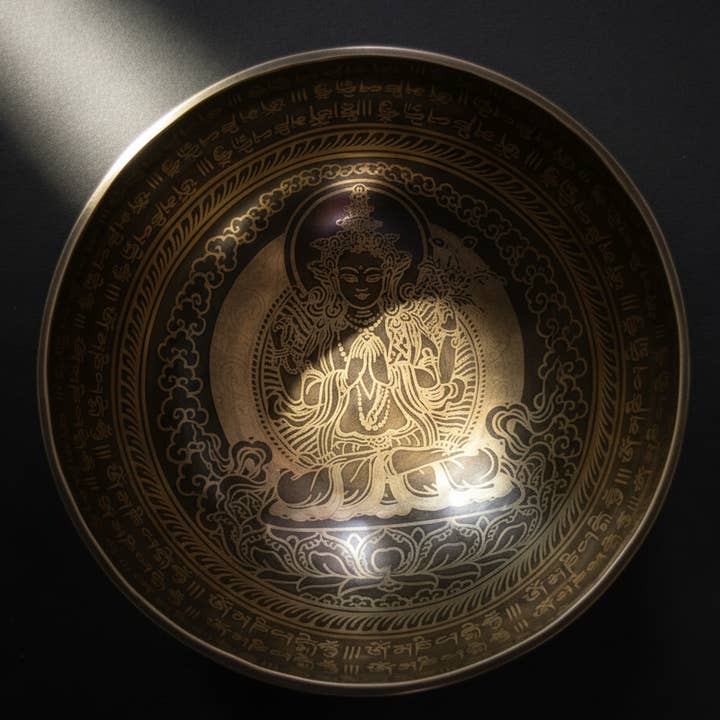 Chenrezig Carved Singing Bowl for wholesale by Art Of Tibet