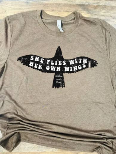 She Flies With Her Own Wings Graphic T-Shirt for wholesale by Sweet Southern Wholesale