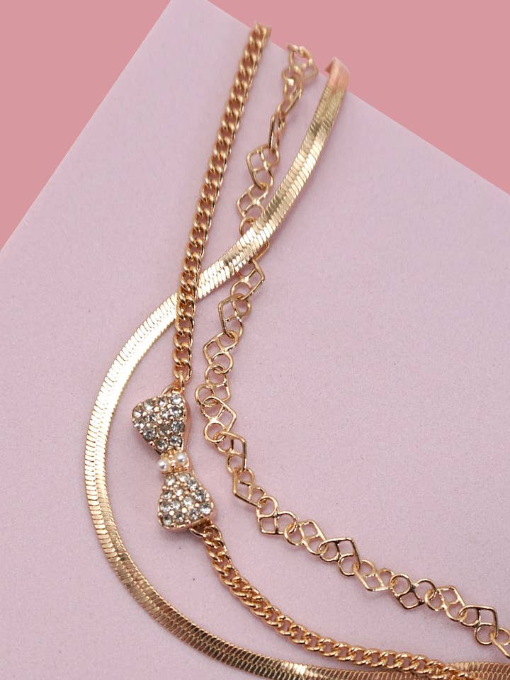 MULTI LAYER BOW CHARM BRACELET | 80B268 for wholesale by JOSSLYN by wall to wall