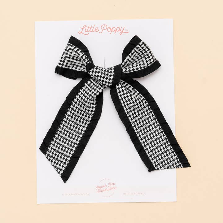 Sort hundetandsmønstret sløjfeklemme for engroshandel hos Little Poppy Co