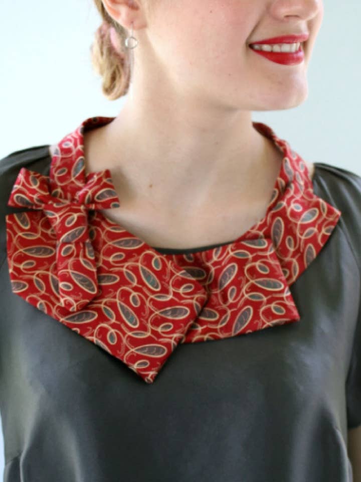 Red Swirl Necktie Necklace for wholesale by Ogsplosh