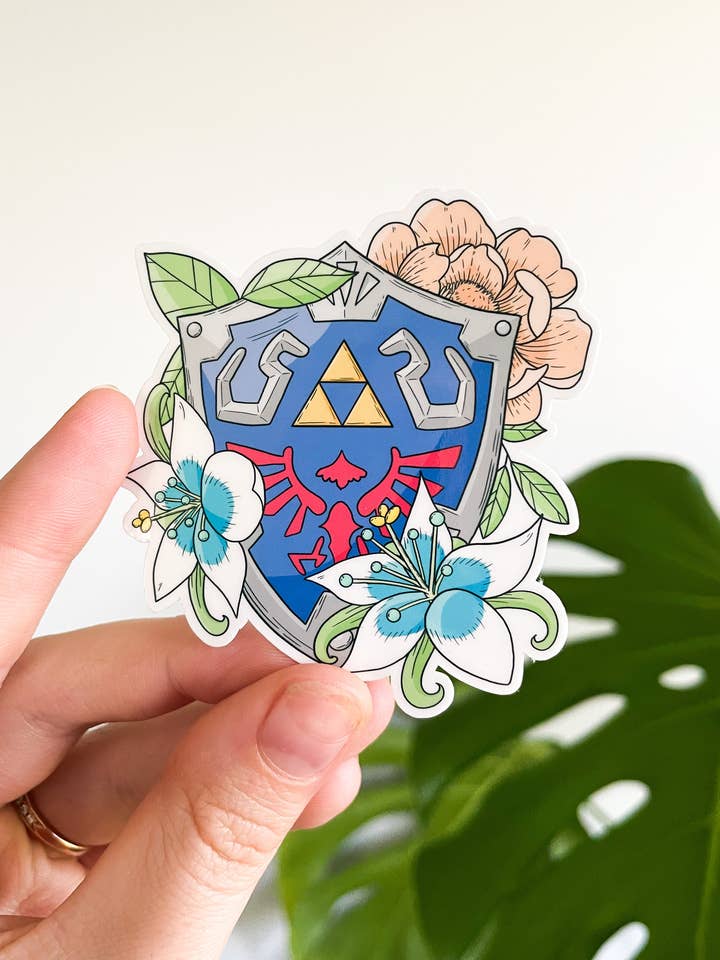 Hylian Shield Vinyl Waterproof Die Cut Sticker for wholesale by Sarah May Arts