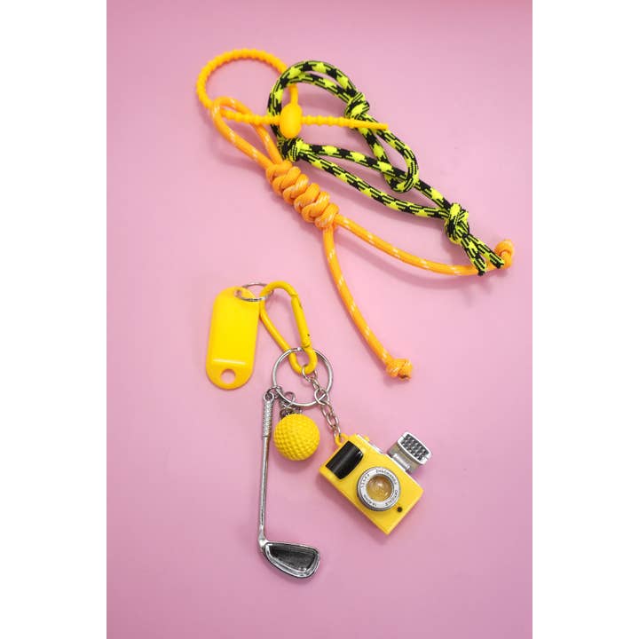 Gold ROPE CORD CAMERA GOLF BAG CHARM KEYCHAIN | 40KC145 for wholesale on Faire