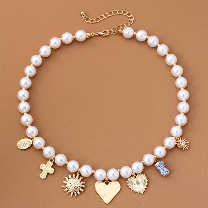 GOLD PEARL NECKLACE-HEART PORCELAIN CROSS SUNBLAST | 80N92610 for wholesale on Faire2