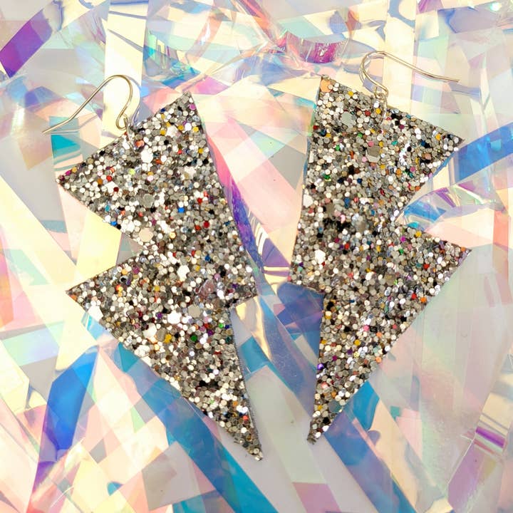 Medium Crushed Pearl Silver Glitter Lightning Bolt Earrings for wholesale by All The Discos