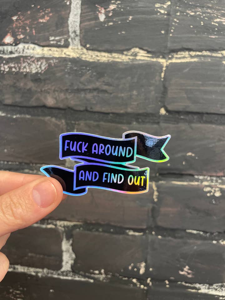 Fuck around and Find Out, 3” Holographic Sticker for wholesale by Three Black Cats Inc.