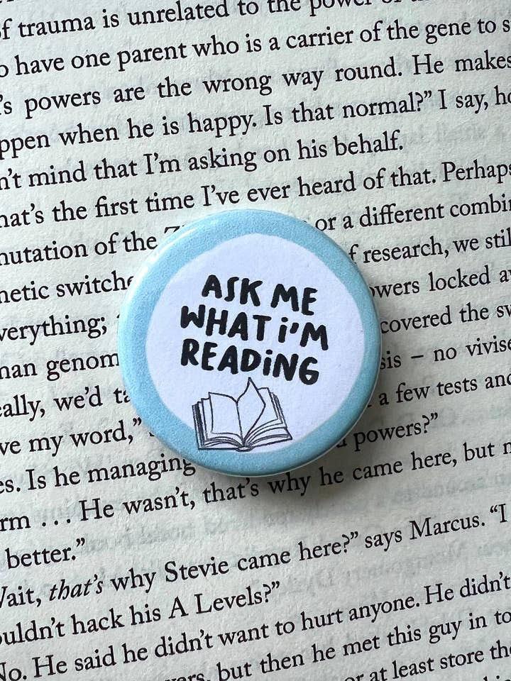 Ask Me What I'm Reading Pin Badge - Book Lover Gift (38mm) for wholesale by Fynedesignshop