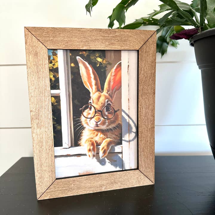 6.5x8.5” Framed Bunny with Glasses in a Window for wholesale by Farmhouse Decor & Co.