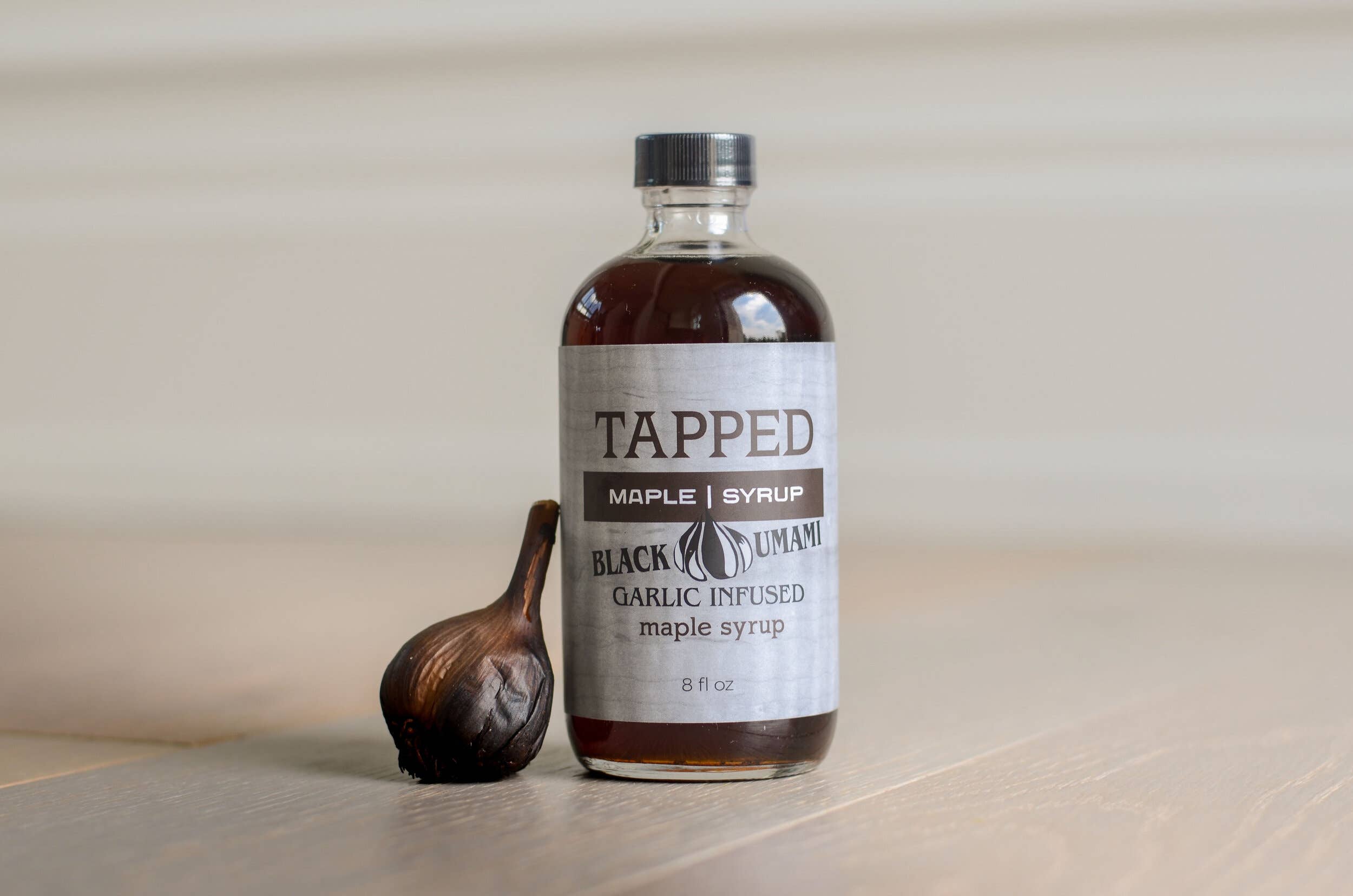 Tapped Maple Syrup, LLC - Wholesale Maple Syrup - Black Umami Garlic Infused Maple Syrup - 2 fl oz
