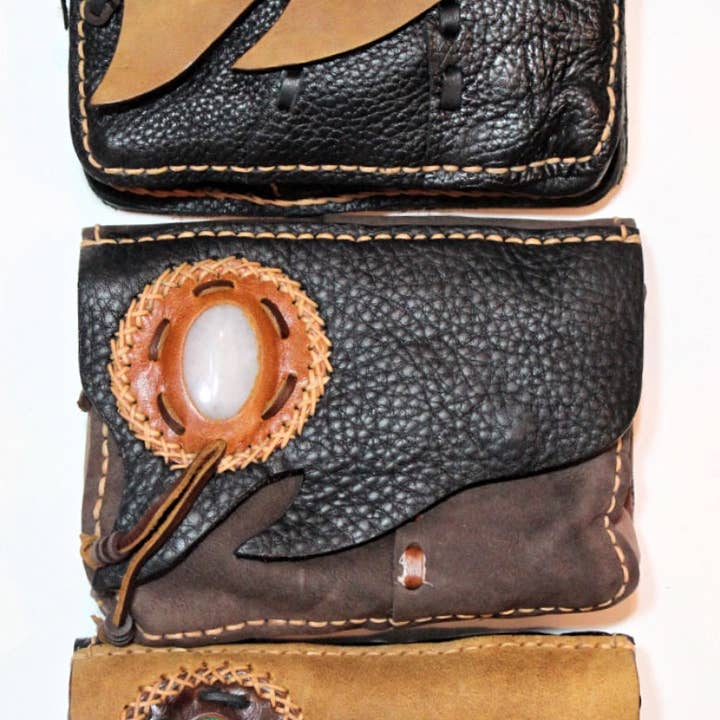 Handmade cowhide leather uneven flap mini travel bag with premium stone accent for wholesale by Atlas Goods By Your Needs Company