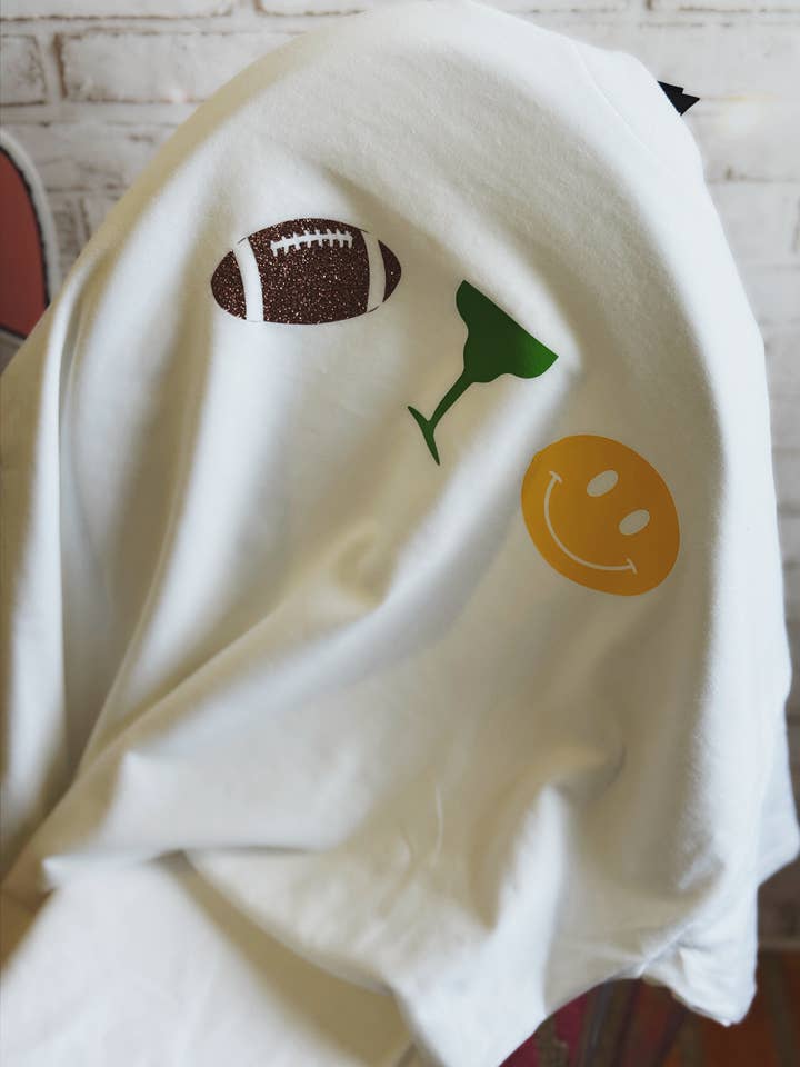 Touchdowns & Tequila Tee – White T-Shirt with Football, Margarita & Smiley Graphic for Game Day Vibes for wholesale by The Maximalist Boutique