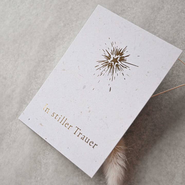 Small card "Silent Mourning" with gold star illustration for wholesale by SAJA Design Atelier