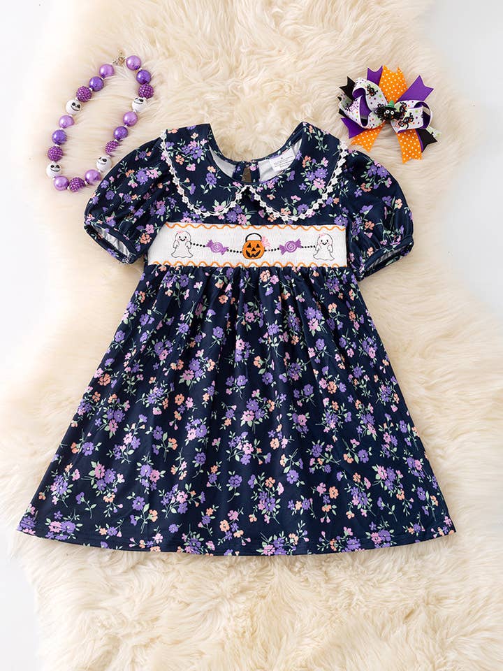 Navy blue floral smocked floral dress with bubble sleeves. DRG52121 SOL for wholesale by Kids Charm Online