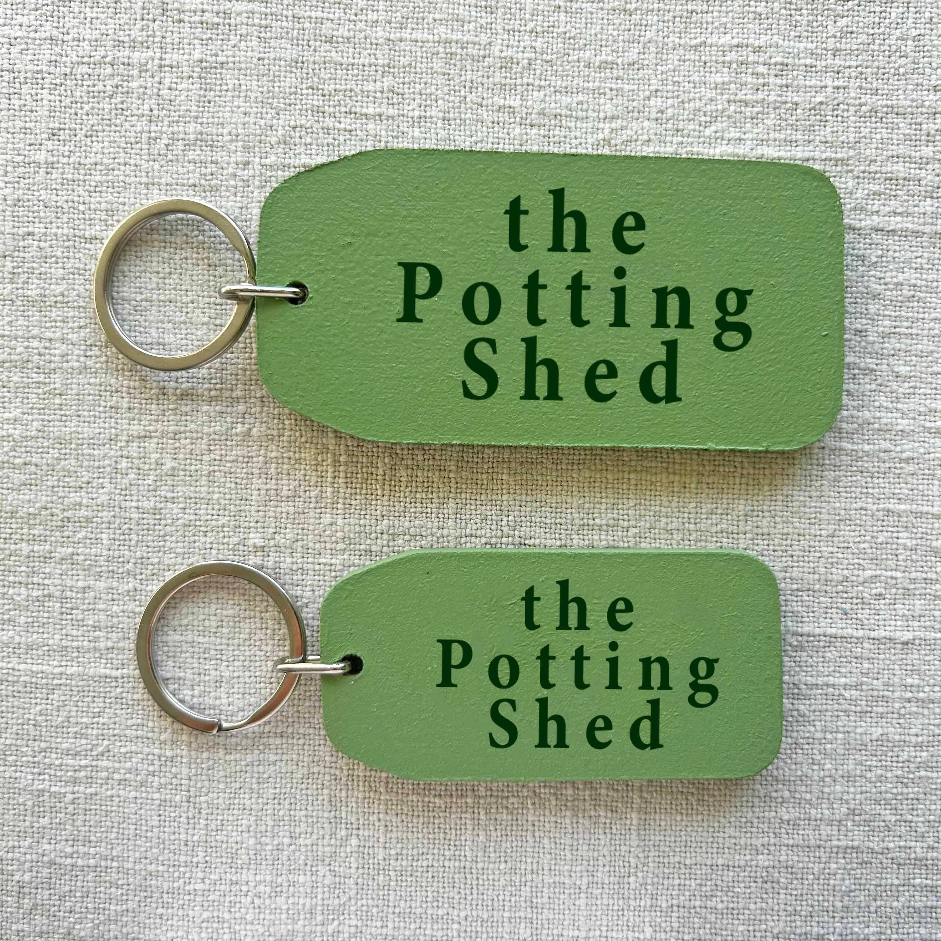 THE WOODEN POSTCARD COMPANY – wholesale Keychain – Unisex – The Potting Shed - Wooden Key Tag0