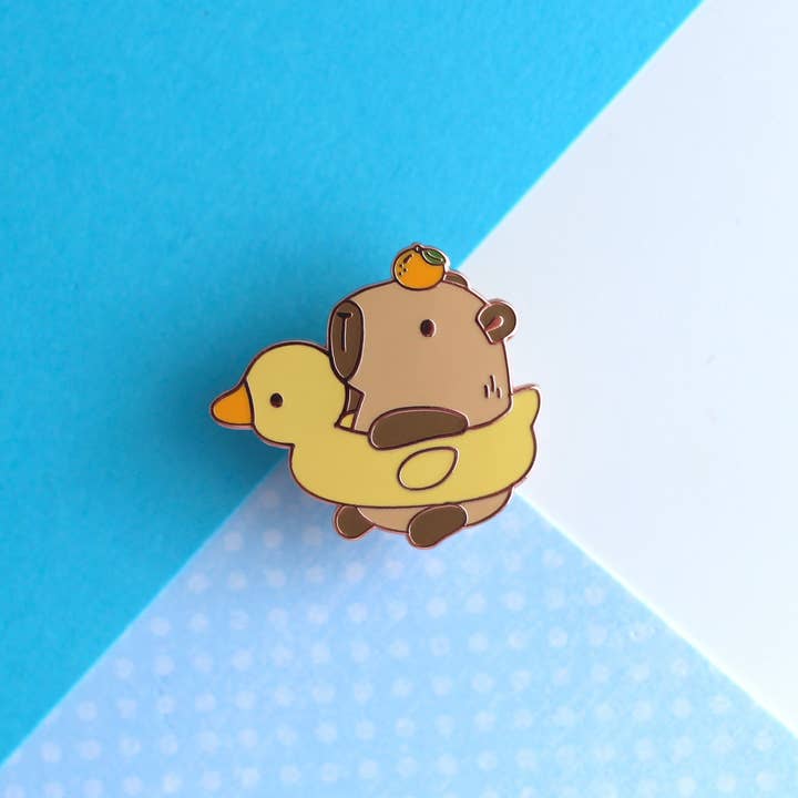 Capybara in a Duck Floatie with Yuzu Enamel Pin for wholesale by Wild Whimsy Woolies