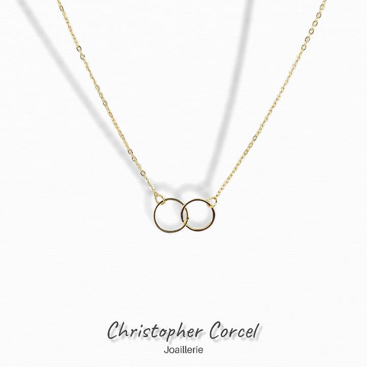 Karma+fin kæde to sammenkædede ringe vedhæng for engroshandel hos Christopher Corcel