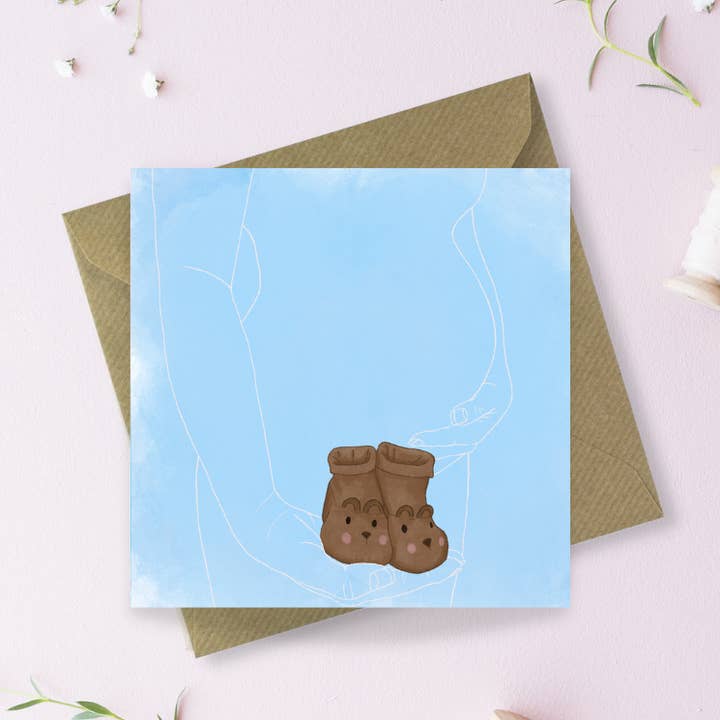 Baby Boy Booties lykønskningskort for engroshandel hos Sayers Studio