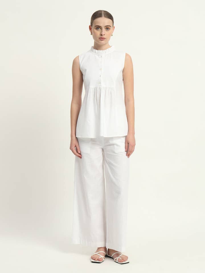 Set Coordinato Pantaloni - Bianco Vivace Svasato per la vendita all'ingrosso da parte di Thevasa