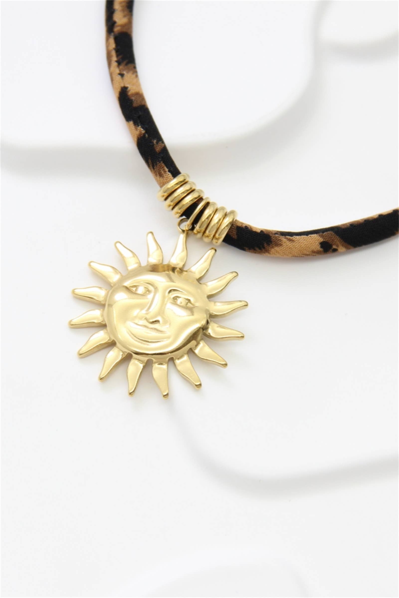 Gold Vintage Sun Necklace in Stainless Steel & Leopard Fabric for wholesale on Faire